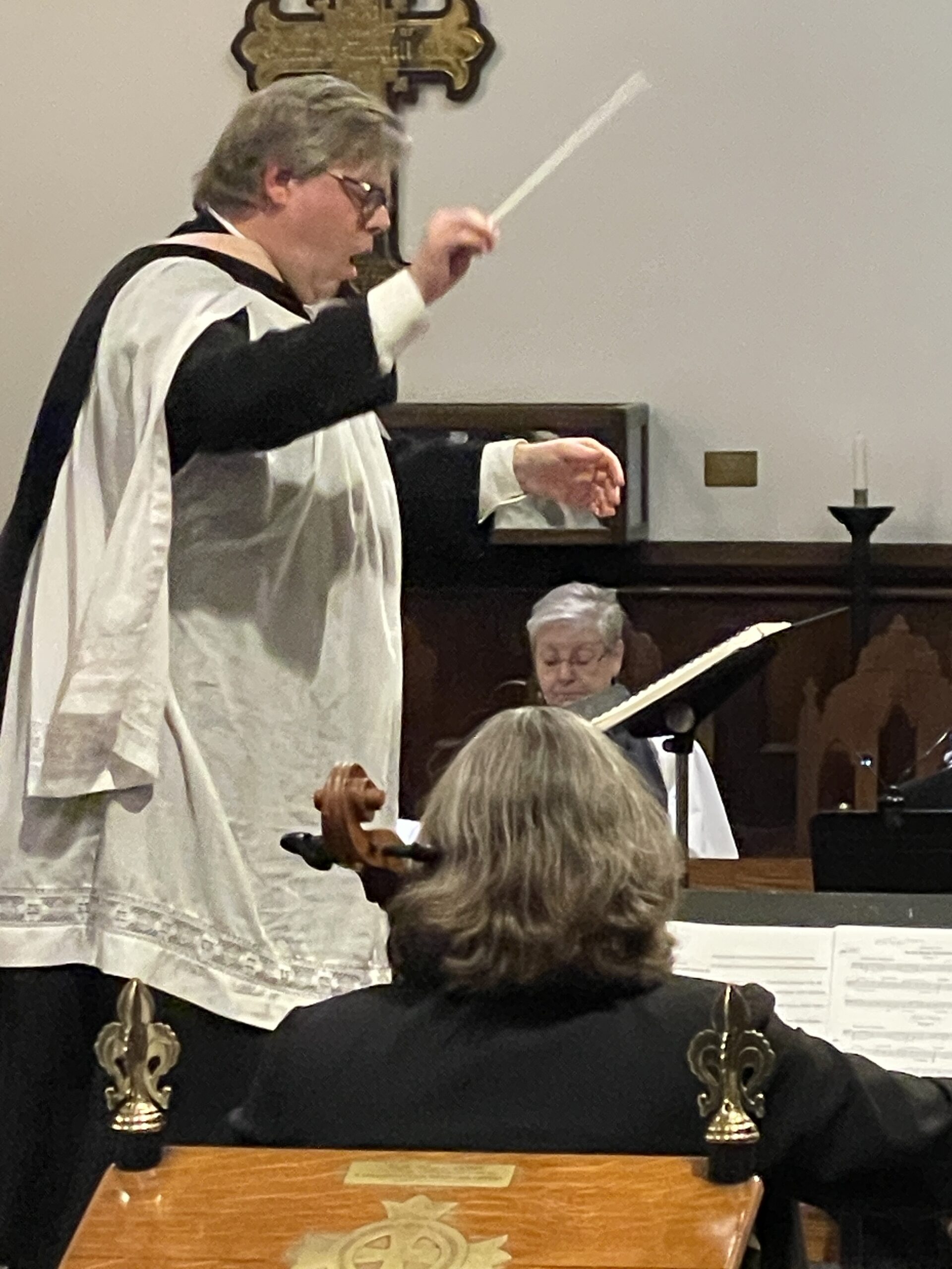 Close-up of John Sabine conducting